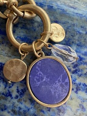 Goldtone Bracelet with a Blue Glass Charm by Plunder Design Private Label